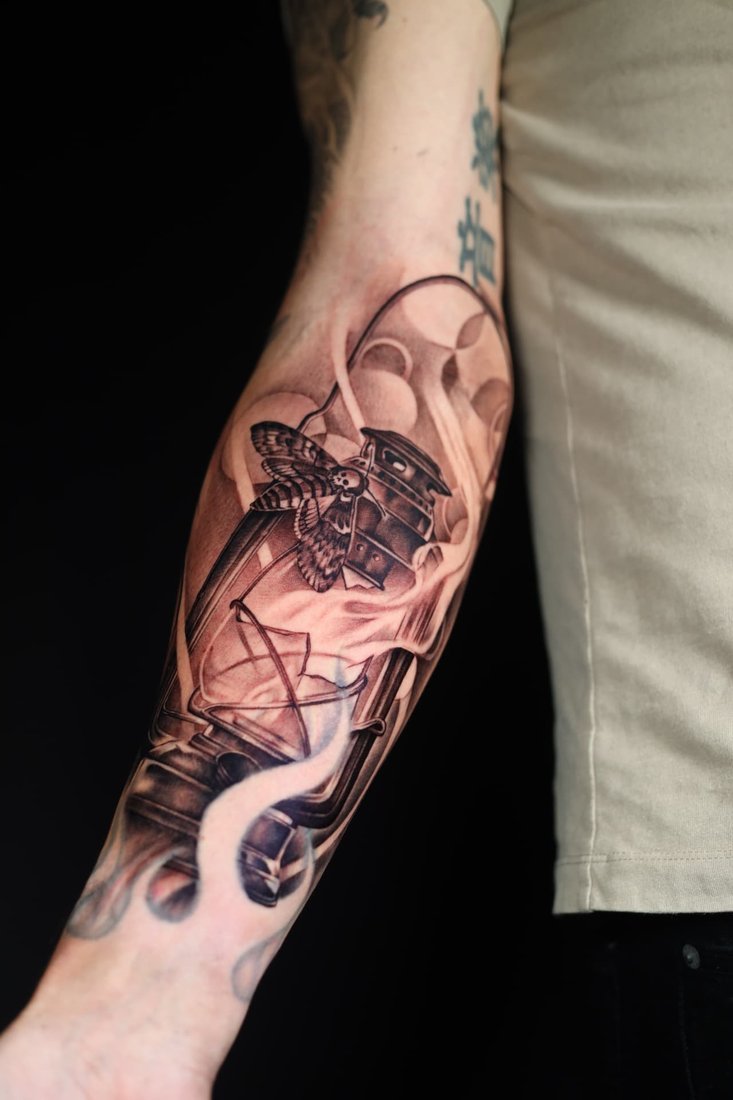 Tattoo: Lantern and moth, forearm