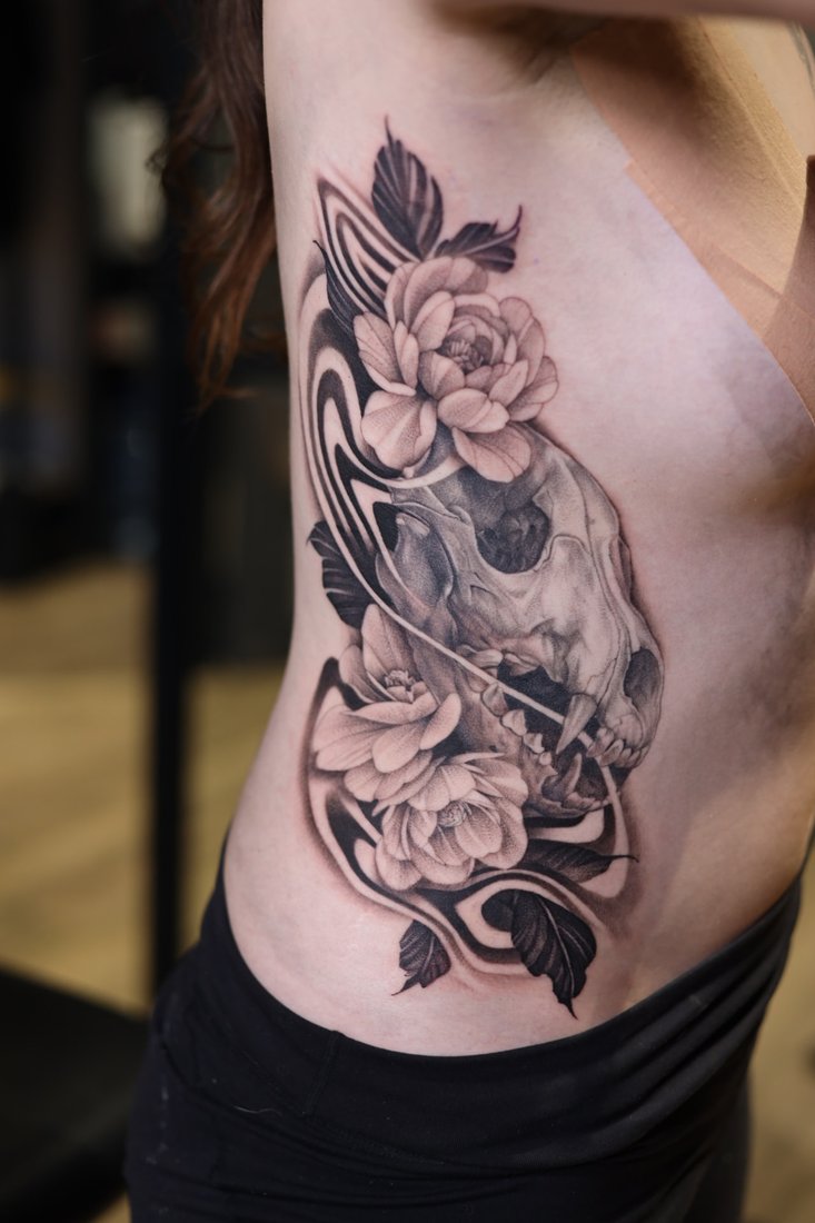 Tattoo: Skull and peonies, ribs